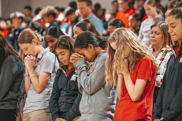 ECS-Middle-School-Chapel-Praying-Girls